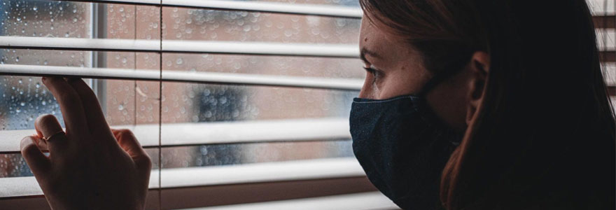 Teen looking out window.