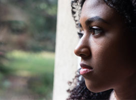 Young girl feeling alone and solitude at home. Photo by Tommaso Altamura (iStock)